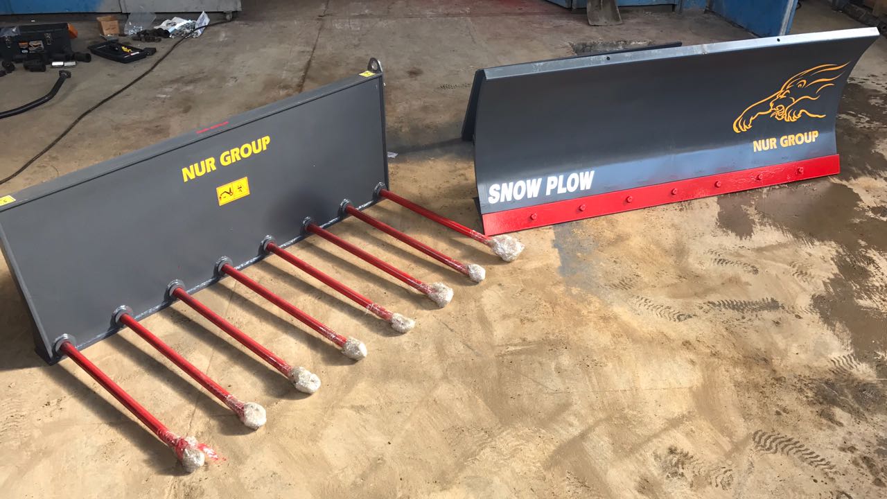 Bale Hugger Attachment for Safe Handling of Wrapped Bales